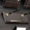 brown leather double pen stand with white stitched trim