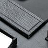 closeup of a black crocodile-grained leather desk pad