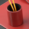 red leather pencil and pen holder with white stitching