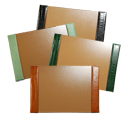 reptile-embossed leather desk pads, shown in black, jade, hunter and luggage